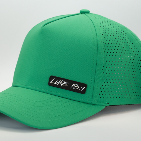 Kelly green cap with black and white "LUKE 18:1" logo
