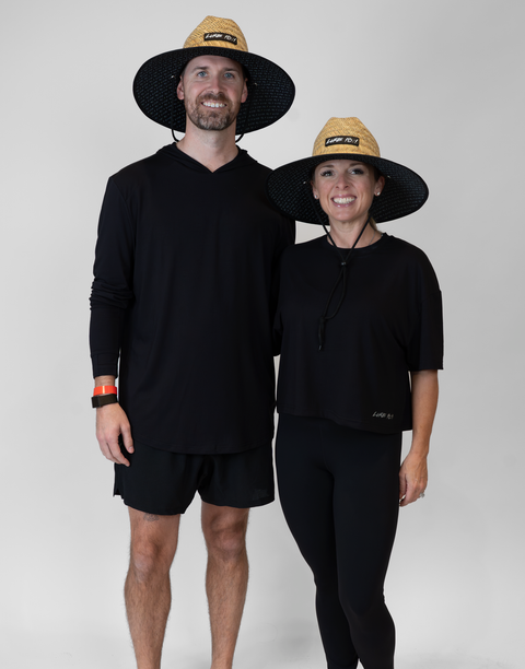 Man and woman both wearing straw hat with "LUKE 18:1" text