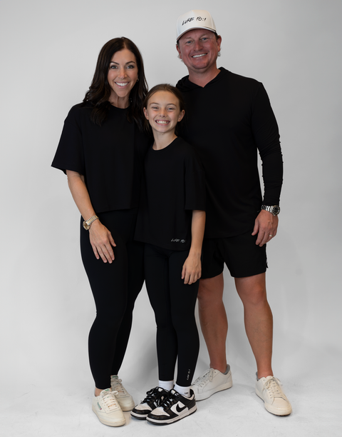 group of people with one man wearing men's black performance hoodie