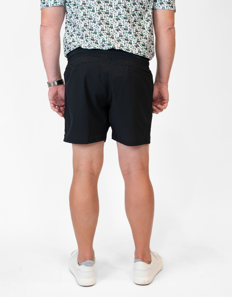 rear view of man wearing Men's Black 6" Airflow Short