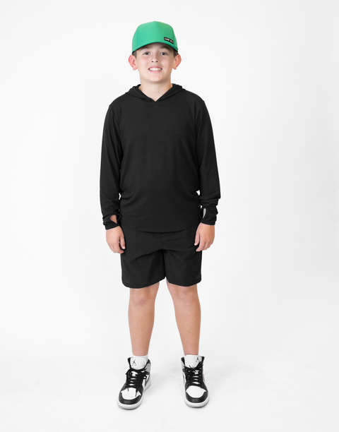 Boy wearing Youth Black Bamboo Performance Hoodie