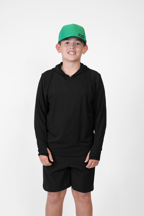 Boy wearing Youth Black Bamboo Performance Hoodie