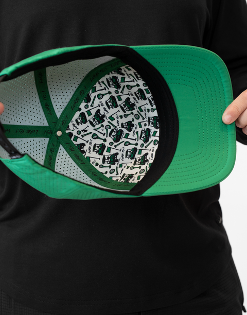 interior view of kelly green hat showing pattern and "LUKE 18:1" text on inside