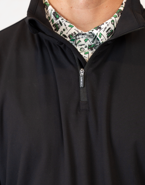 Closeup of Man wearing Men's black Performance 1/4-Zip with "LUKE 18:1" on zipper pull