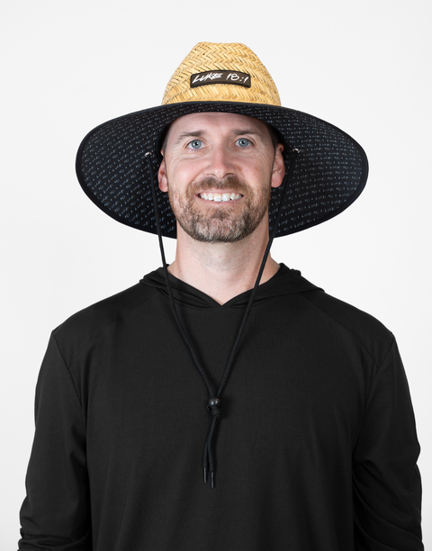 Man wearing straw hat with "LUKE 18:1" text