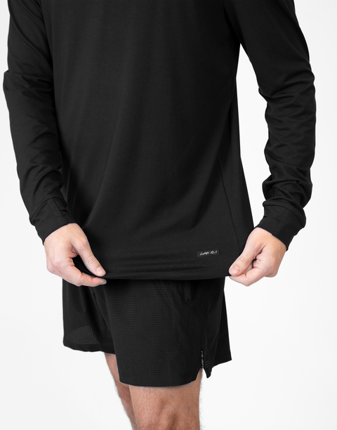 closeup of front of Man wearing Men's Black Bamboo Performance Hoodie showing "LUKE 18:1" text above bottom seam