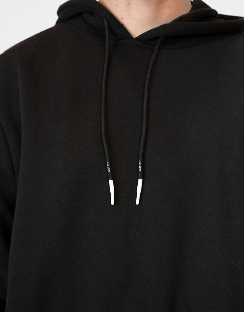 Man wearing Men's Black Fleece Hoodie showing white tips and "LUKE 18:1" text on drawstring