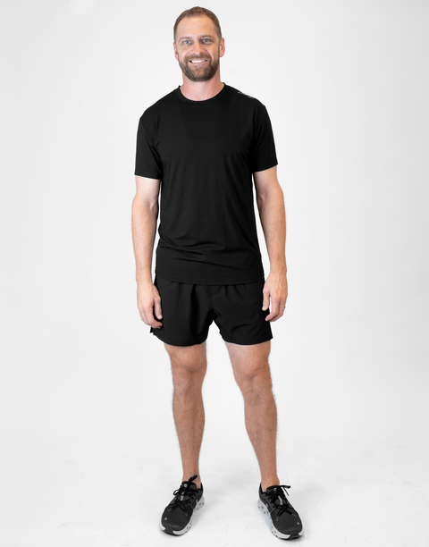 Man wearing Men's black Bamboo Performance Tee