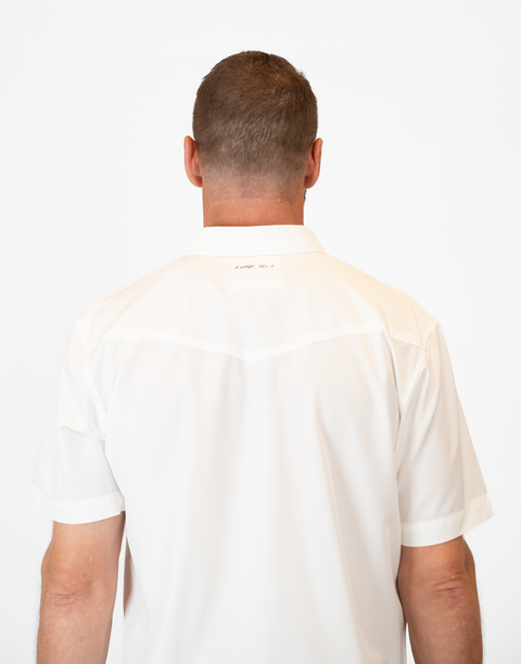 rear view of Man wearing Men's White S/S Pearl Snap Shirt showing "LUKE 18:1" text on upper back