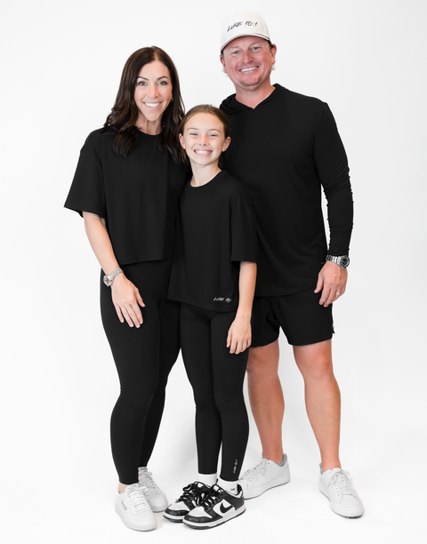 group of people with one man wearing men's black performance hoodie