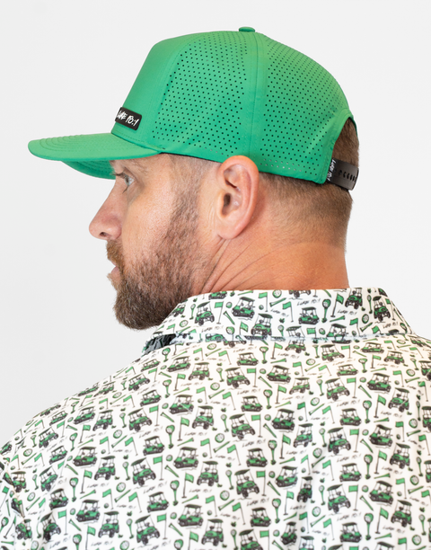 side view of man wearing kelly green hat showing rear mesh