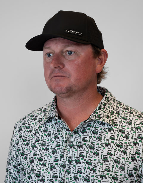 man wearing black hat with "LUKE 18:1" text