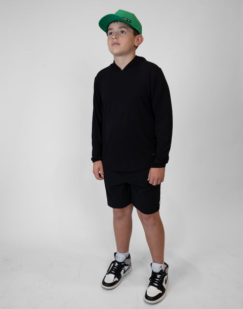 Boy wearing Youth Black Bamboo Performance Hoodie