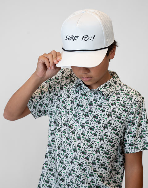 Person wearing white hat with black "LUKE 18:1" text