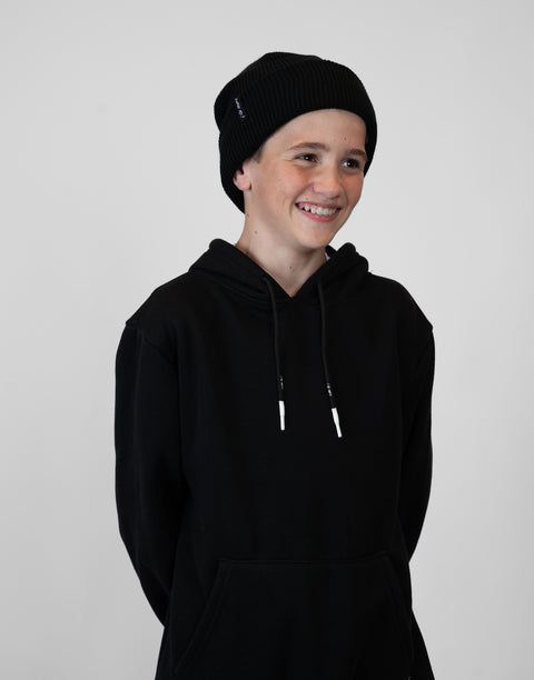 person wearing black beanie with "LUKE 18:1" text
