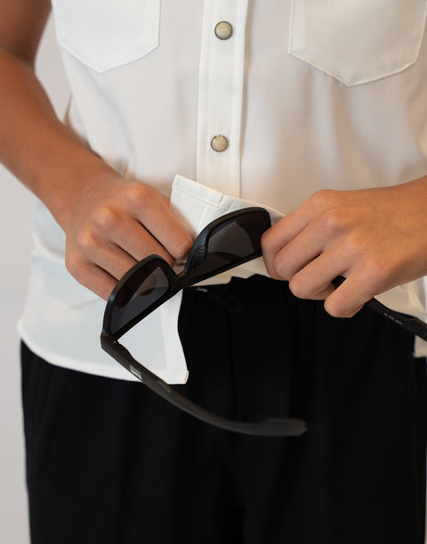 Boy wearing Youth White S/S Pearl Snap Shirt showing glasses cleaner