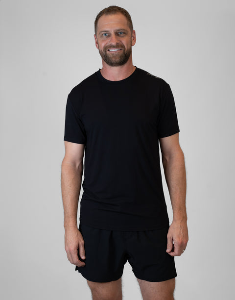 Man wearing Men's black Bamboo Performance Tee