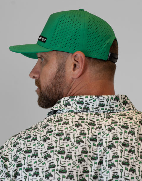 side view of man wearing kelly green hat showing rear mesh