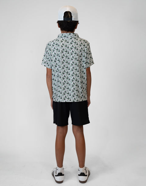 Rear view of boy wearing Youth Performance Golf Polo