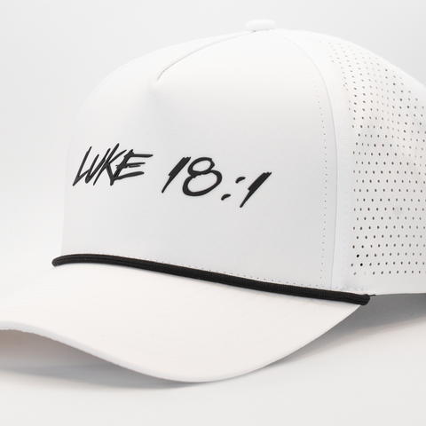 White hat with black "LUKE 18:1" text on front