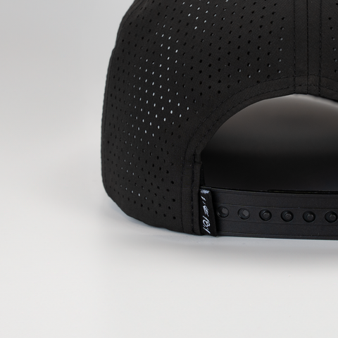 Rear view of Black cap with white "LUKE 18:1" label on back