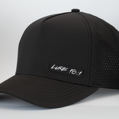 Black cap with white "LUKE 18:1" logo