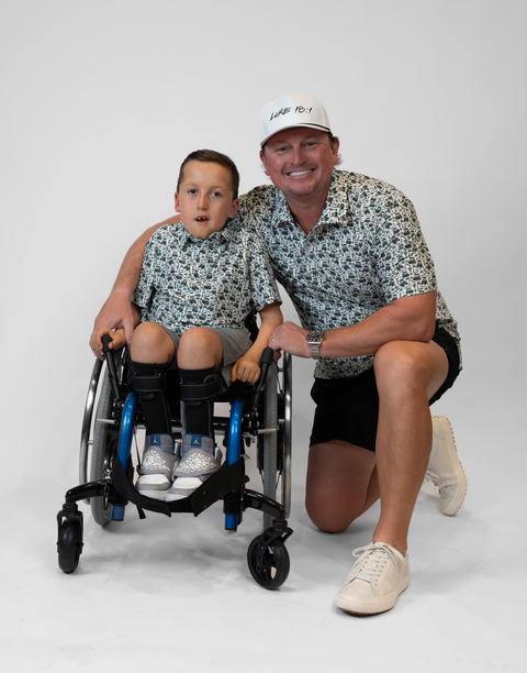 Two people wearing matching performance golf polos