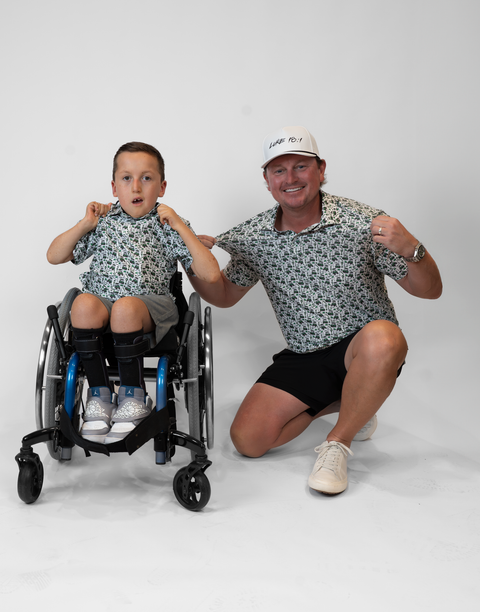 Two people wearing matching performance golf polos