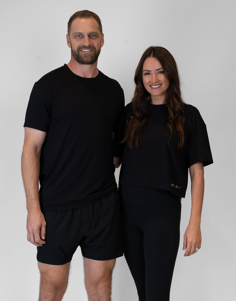 Man and woman with man wearing men's black Bamboo Performance Tee