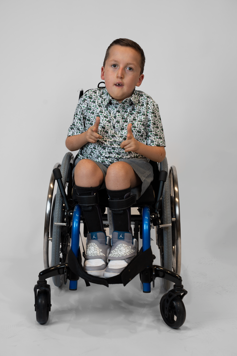 Boy wearing Youth Performance Golf Polo