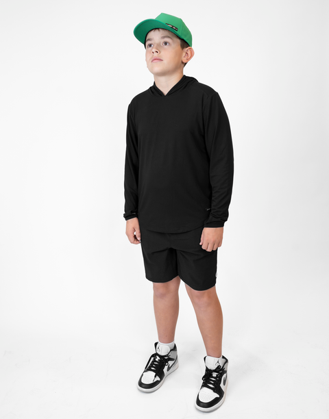 Boy wearing Youth Black Bamboo Performance Hoodie