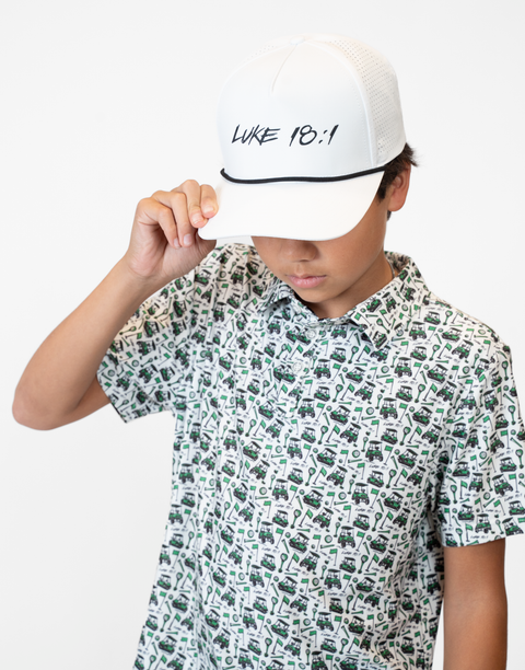 Person wearing white hat with black "LUKE 18:1" text