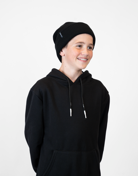 person wearing black beanie with "LUKE 18:1" text