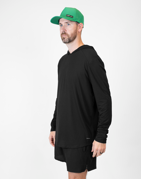 Man wearing Men's Black Bamboo Performance Hoodie