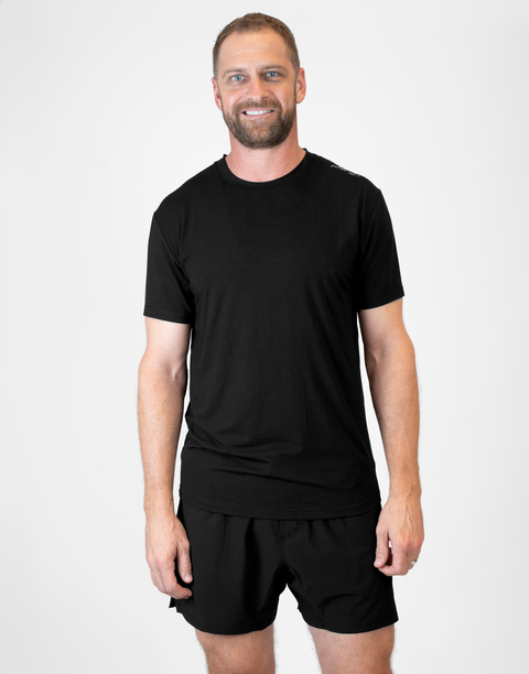 Man wearing Men's black Bamboo Performance Tee