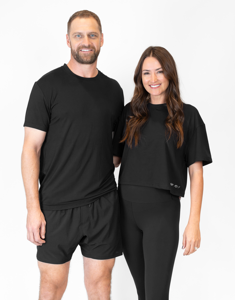 Man and woman with man wearing men's black Bamboo Performance Tee