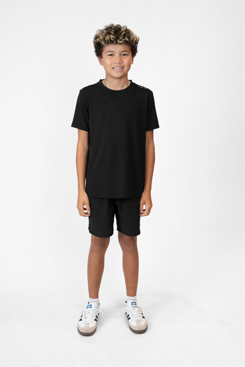 Boy wearing Youth black Bamboo Performance Tee