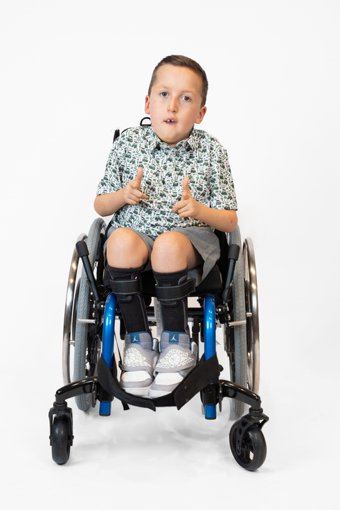 Boy wearing Youth Performance Golf Polo