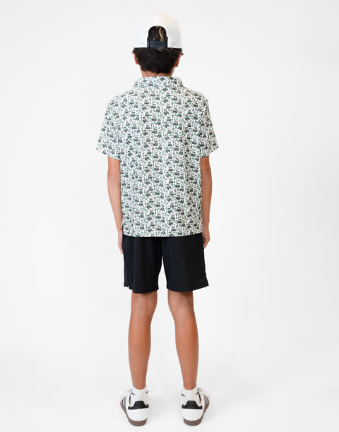 Rear view of boy wearing Youth Performance Golf Polo
