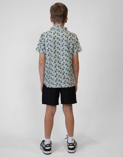 Rear view of boy wearing Youth Performance Golf Polo