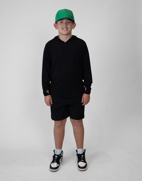 Boy wearing Youth Black Bamboo Performance Hoodie