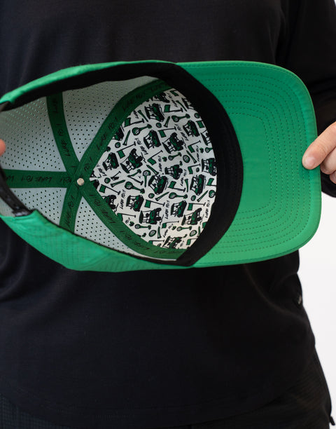 interior view of kelly green hat showing pattern and "LUKE 18:1" text on inside