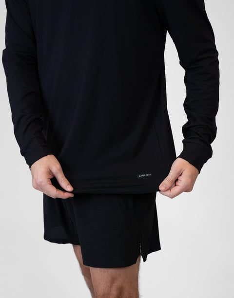 closeup of front of Man wearing Men's Black Bamboo Performance Hoodie showing "LUKE 18:1" text above bottom seam