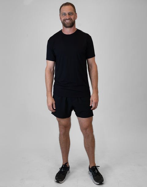 Man wearing Men's black Bamboo Performance Tee
