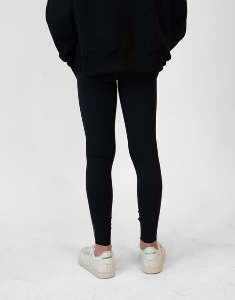 rear view of person wearing black Ladies Performance Legging