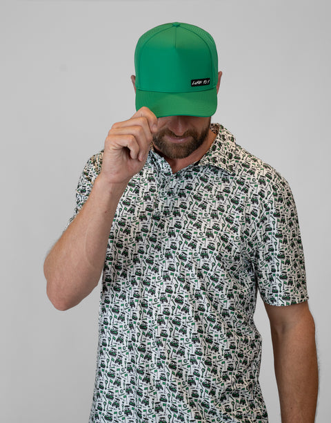 Man wearing kelly green hat with "LUKE 18:1" text