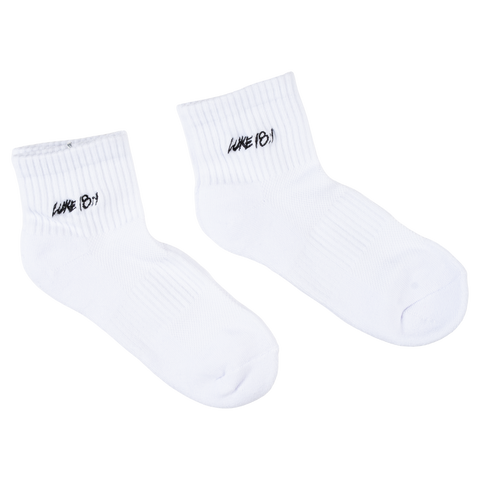 White socks with black "LUKE 18:1" text on ankle